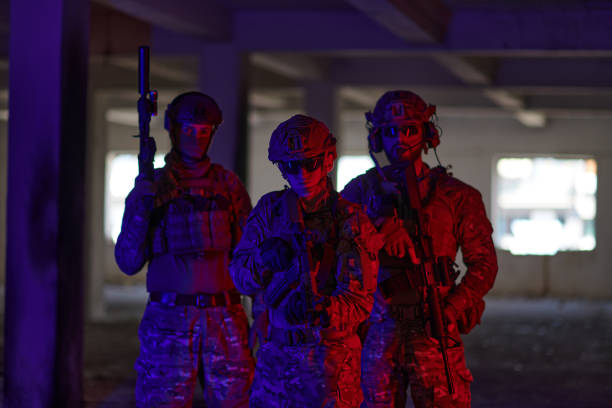 istock Soldier squad team walking in urban environment colored lightis 1534189694
