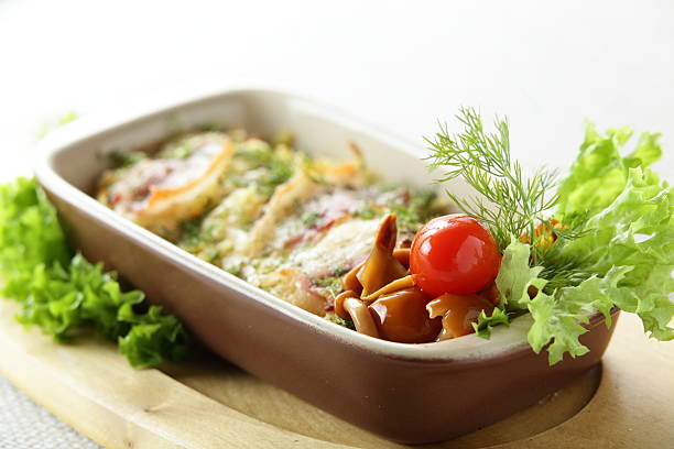 mushrooms, meat and some vegetables in brown dish