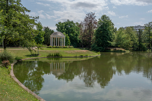 ancient temple in the public park of the city of Vicenza called PARCO QUERINI  with the dome of the tee and oxidized copper roof and little pond