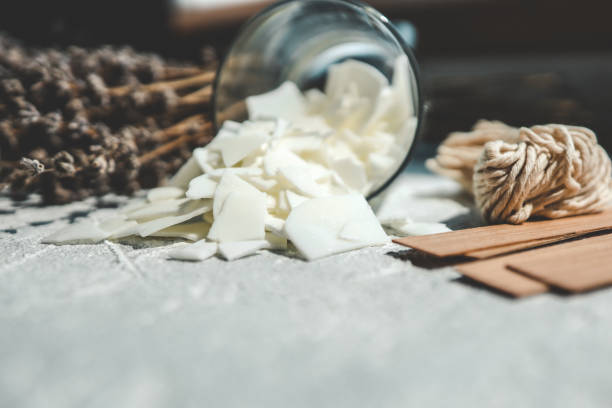 istock Glass with soy wax and lavender, candle making concept 1534223307