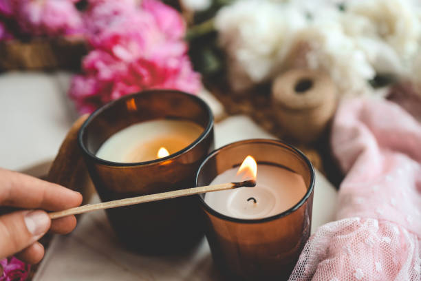 istock Match in hand lights a candle, atmospheric photo 1534223722