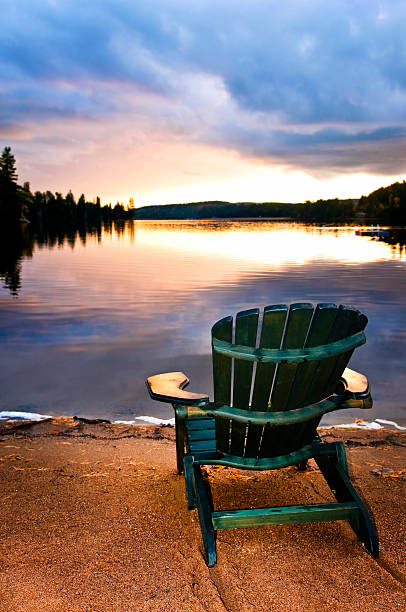 istock Wooden chair at sunset on beach 153422732