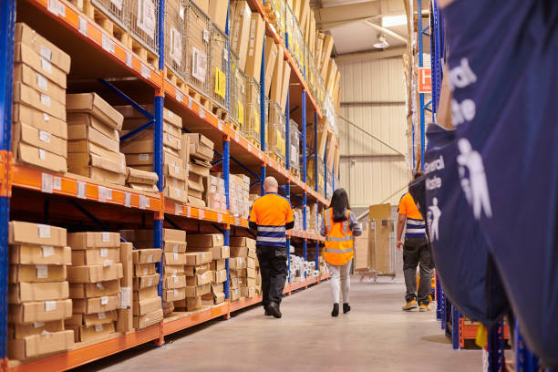 istock female warehouse supervisor with colleagues 1534233125