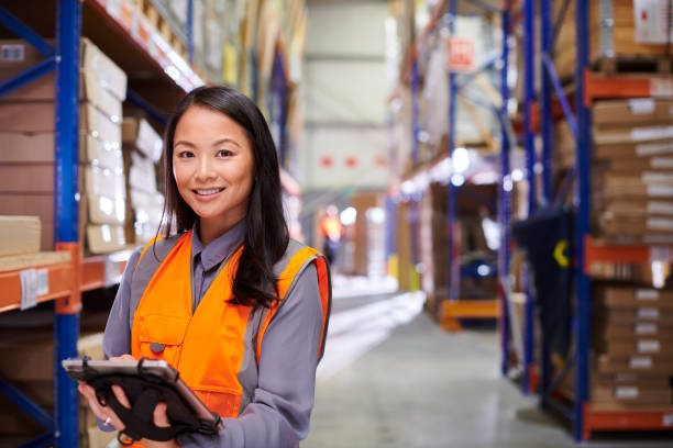 istock female warehouse manager with digital tablet 1534234742