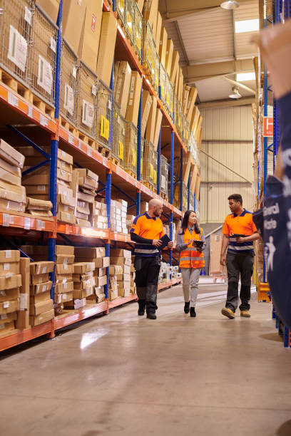 istock female warehouse supervisor with colleagues 1534244923