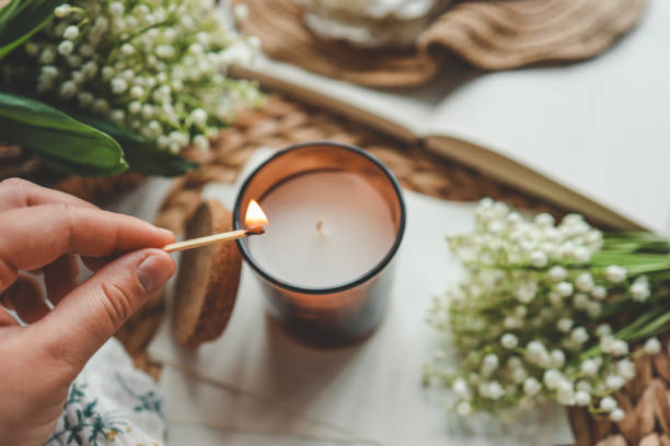 istock Match in hand lighting candles, aesthetics 1534253074