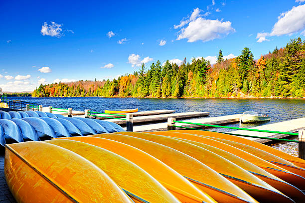 istock Canoe rental on autumn lake 153426674