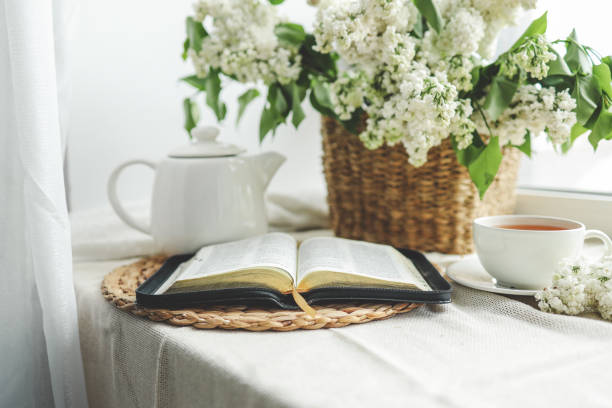 istock Open bible in spring interior, good morning concept 1534273313