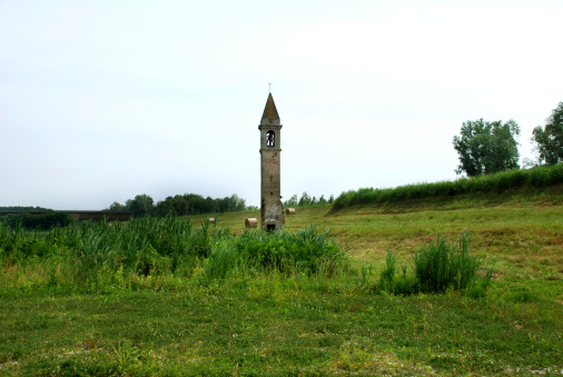 Ancient bell tower on the bank of the river Po, in Rivà of Ariano Polesine, which is one of the symbols of the park of the Po Valley