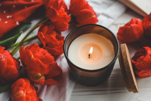 istock Cozy spring composition, burning candle, peonies and hat 1534281410