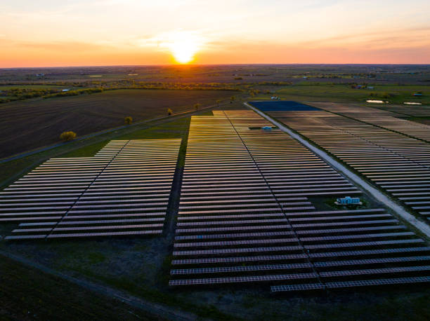 istock Sunlight reflects off Solar Panels above Solar Farm 1534286058