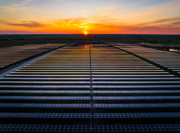 istock Perfect Symetrical Sunset over Solar Panel Power Plant 1534288678