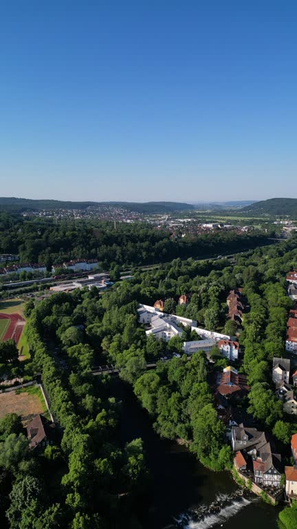 drone flight over river in historic Marburg