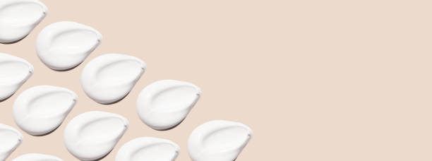 istock Beautiful different smears of cream and cosmetics on a delicate beige background. With empty space for advertising and inscriptions. 1534307672