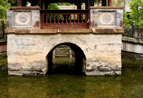 The Wen Long Pavilion over its basements, amidst the green water of the pond in the central courtyard of the Wenchang Gong-Temple of Studies and Literature, Weibaoshan-Mountain with 20 taoist temples, Yunnan, China.