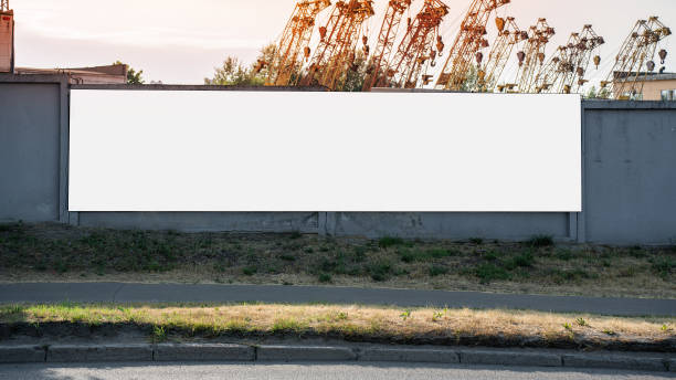 istock Long blank banner with empty space mounted on cement fence 1534331659