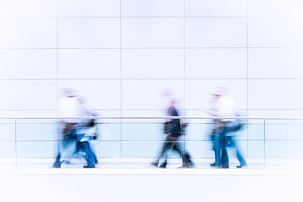 istock Many business people in blurred motion 153434905