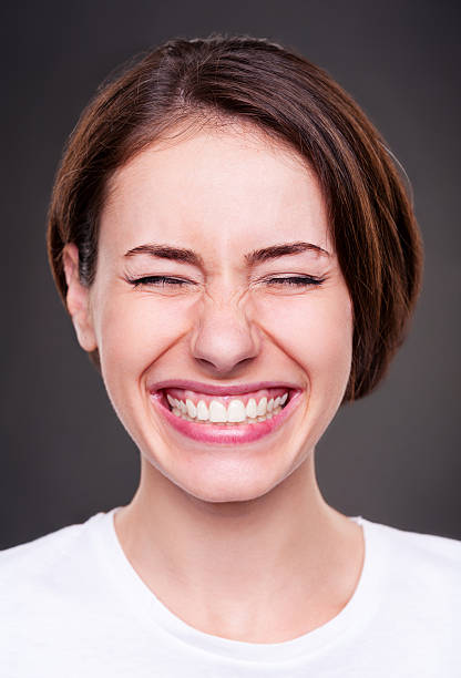 istock young woman is laughing loudly 153435116