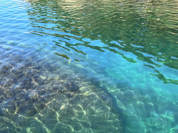 istock Sea water turquoise crystal clear surface. 1534353916
