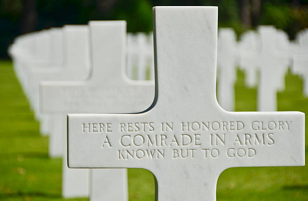 Known but to God A tribute to an unknown soldier at the American cemetery in Normandy France.  The cemetery is overlooking the cliffs of the famous Omaha Beach and the English Channel. normandy stock pictures, royalty-free photos & images