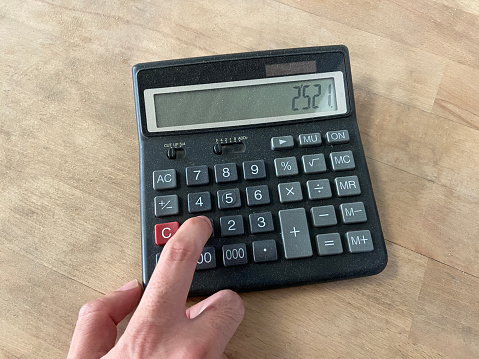 Asian businessman with a calculator