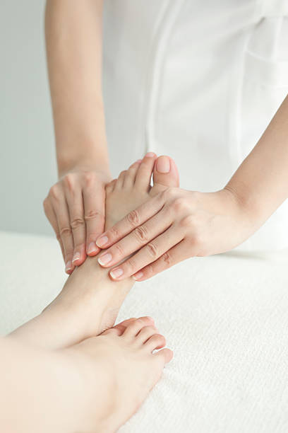 istock The beautician who massages a foot 153438162