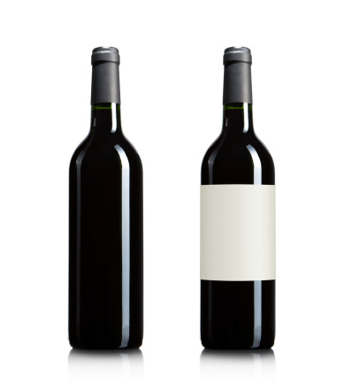 Blank red wine bottles isolated on white background with copy space