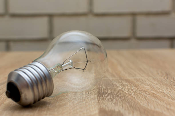 An incandescent lamp consumes much more electricity