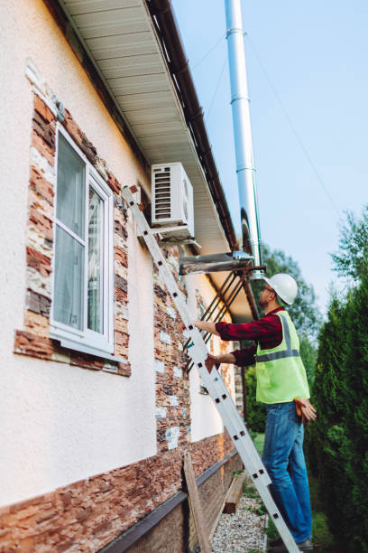 istock Technician in uniform repairing heat pump 1534423265