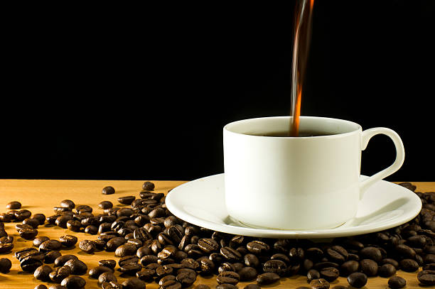 istock pouring a cup of coffee 153442368