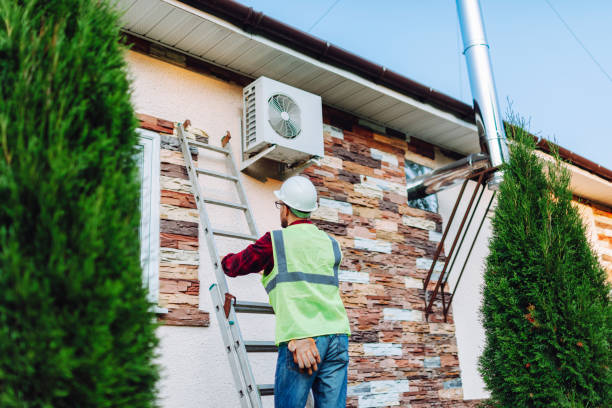 istock Technician in uniform repairing heat pump 1534426339