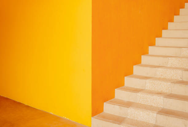 istock Metal stairs on the big orange wall 1534431833