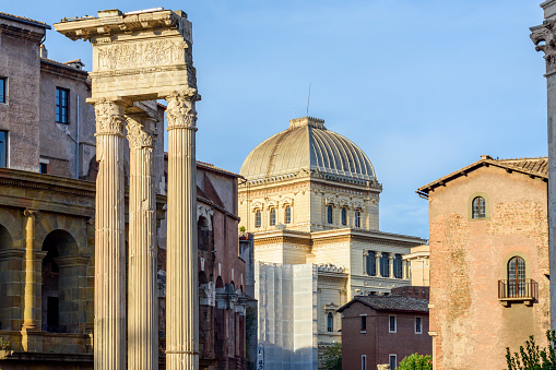 Trajan's Column at the Imperial Forums in Rome with the Basilica of the XII Santi Apostoli in the background