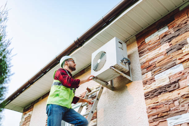 istock Technician in uniform repairing heat pump 1534458799