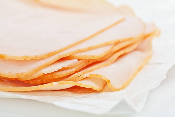 istock Turkey salami slices on the white paper 153446202