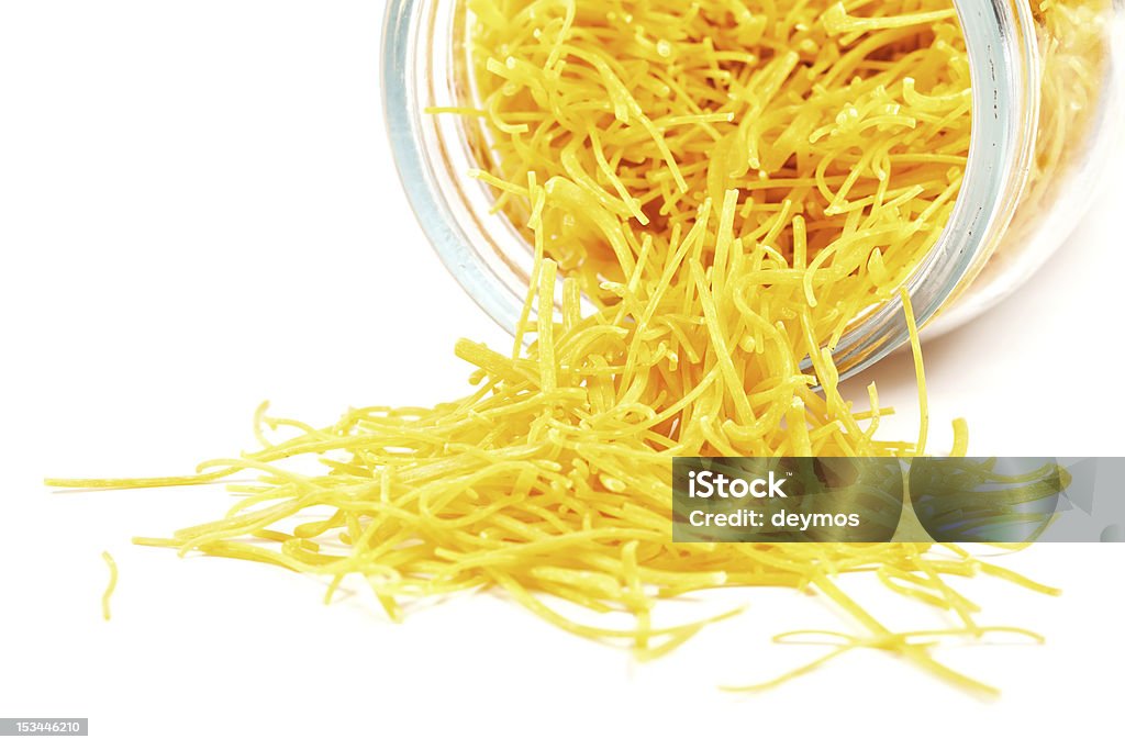 Homemade pasta coming out of glass jar, on white background Homemade pasta coming out of a glass jar, on white background Carbohydrate - Food Type Stock Photo