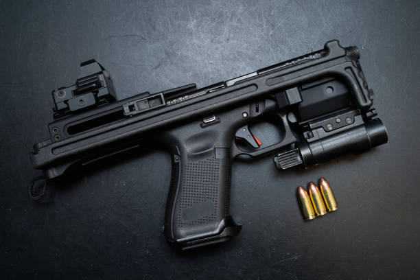 istock Tactical weapon, pistol conversion kit and 9mm ammo. 1534470292