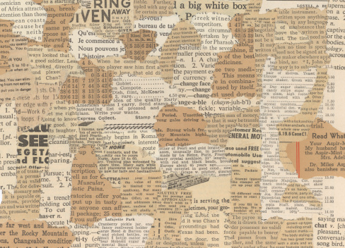 Torn old newspapers make a grunge background