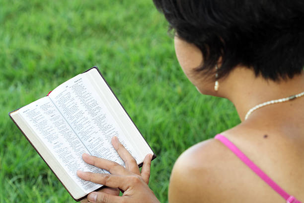 istock Woman reading Bible 153447564