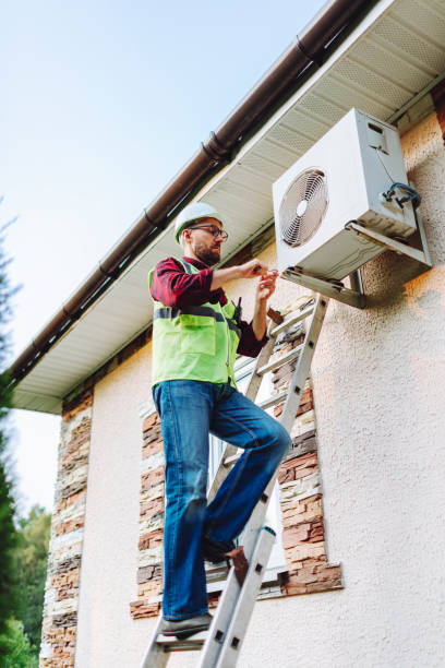 istock Technician in uniform repairing heat pump 1534475993
