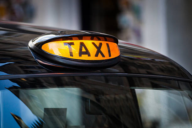 istock Taxi sign in UK 153447751