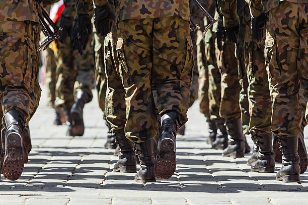 istock Soldiers march in formation 153448825