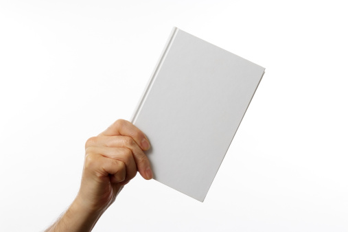 Holding a blank book for your copy text against white background. 