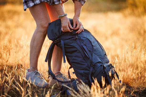 istock Hiker opening backpack while trekking in nature at summer 1534519879