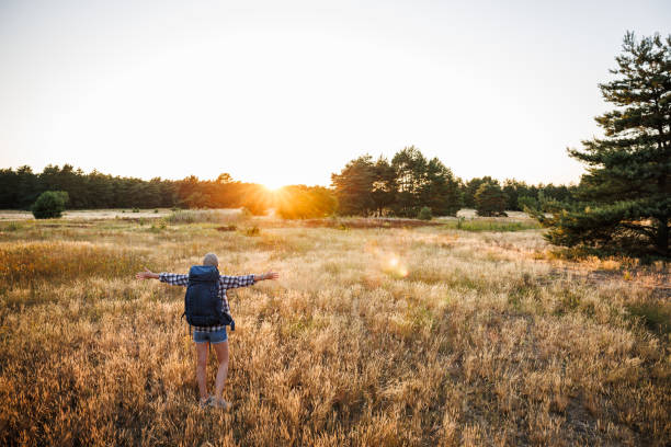istock Happy woman has found perfect place for camping outdoors before sunset 1534519887
