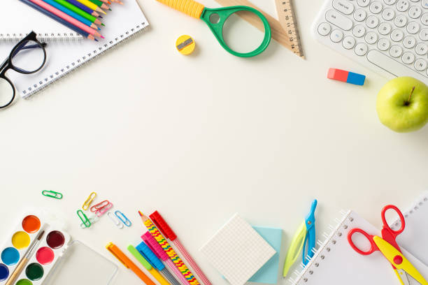 istock Dive into the realm of virtual learning with this top-down picture showcasing a keyboard, notebooks and educational essentials on white backdrop. Customize copy-space with text or promotional content 1534520935