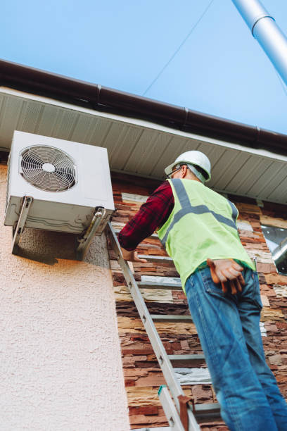 istock Technician in uniform repairing heat pump 1534521492