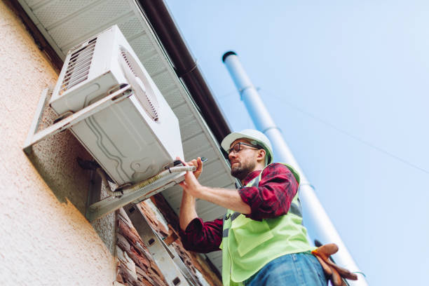 istock Technician in uniform repairing heat pump 1534521501