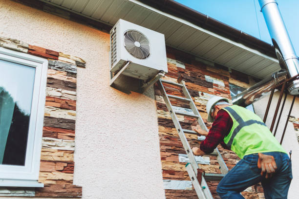 istock Technician in uniform repairing heat pump 1534522069