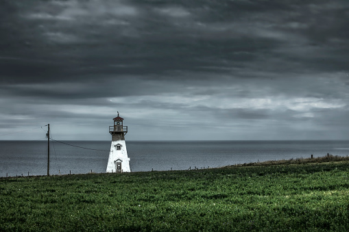 Lighthouse, Cape Tryon Lighthouse, north shore of Prince Edward Island, Canada on an overcast afternoon.